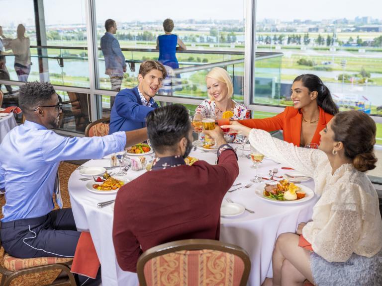 A group of six people performing a toast